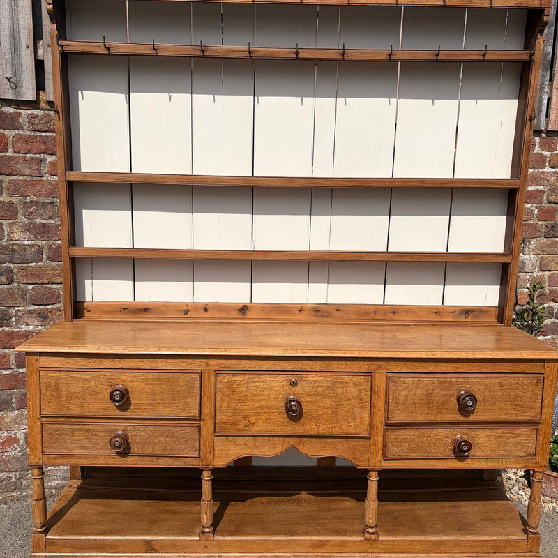 Wooden cabinet with glass panels on a stone wall background